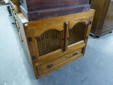 A CONTINENTAL PINE FOOD HATCH WITH TWO DOORS WITH SPINDLE PANELS, ONE LONG DRAWER BELOW, 3?2? WIDE