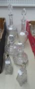 PAIR OF CUT GLASS PEDESTAL DECANTERS WITH STOPPERS, ANOTHER, SMALLER PAIR and a PAIR OF SQUARE,