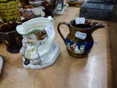 NINETEENTH CENTURY PORCELAIN TOBY JUG, unmarked, and a PORTUGUESE PALISSY WARE WATER JUG,