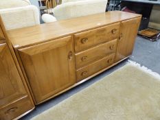 ERCOL BLONDE ELM SIDEBOARD, WITH THREE CENTRE DRAWERS AND END CUPBOARDS, 5?1? WIDE