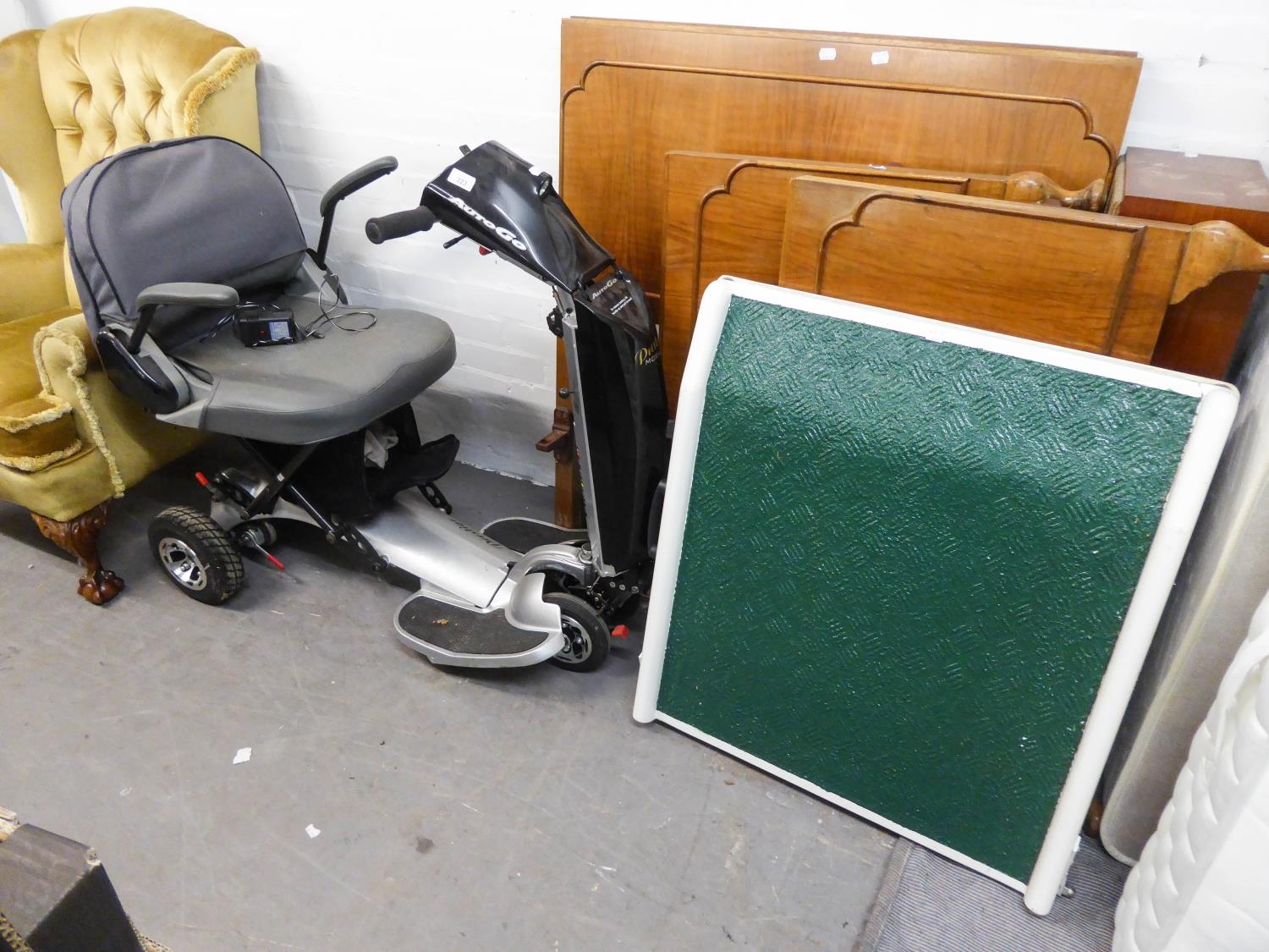 A PRESTIGE MOBILITY 'AUTOGO' ELECTRIC SCOOTER AND A FOLDING RAMP (WORKING CONDITION UNKNOWN, NO