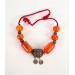 EASTERN AMBER AND SILVER COLOURED METAL NECKLACE, 24? (61cm) total length, largest piece of amber