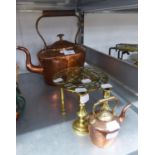 AN ANTIQUE COPPER OVAL KETTLE; A BRASS CIRCULAR TRIVET; A BRASS MINIATURE KETTLE AND A PAIR OF BRASS