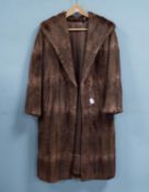 BROWN MUSQUASH FULL-LENGTH FUR COAT with shawl collar, hook fastening single breasted front, slit