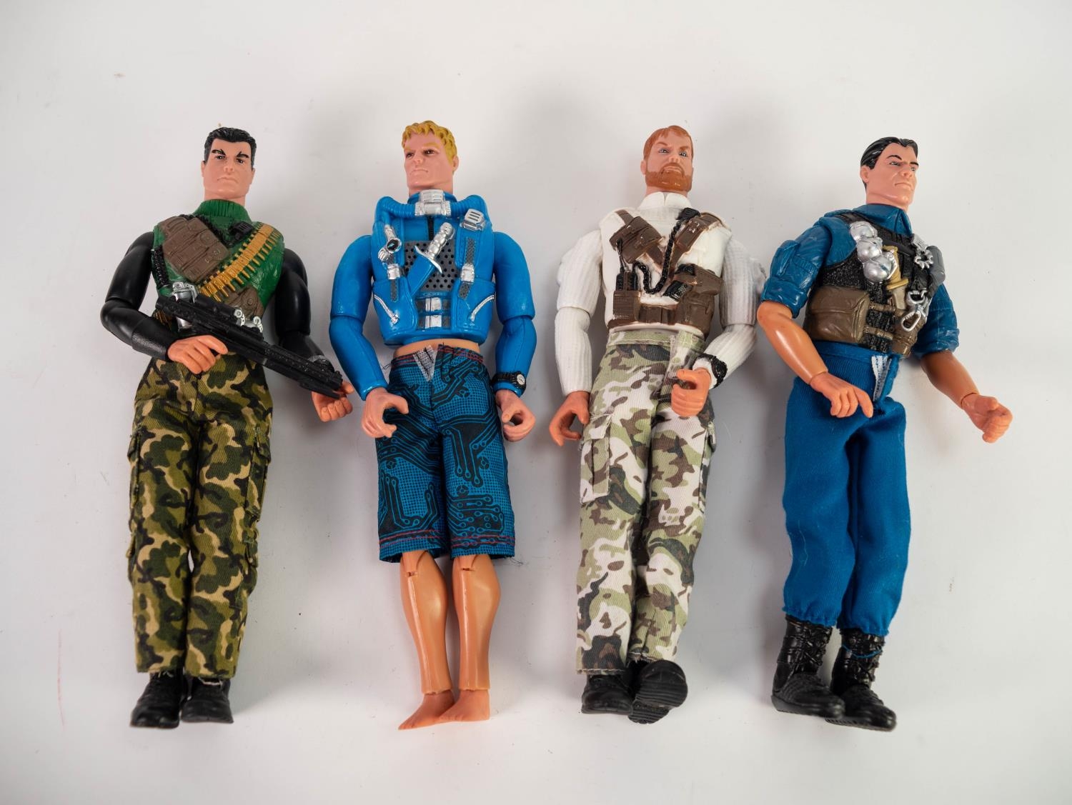 FOUR ACTION MAN TYPE MILITARY ACTION FIGURES, with moveable limbs, the upper bodies with moulded