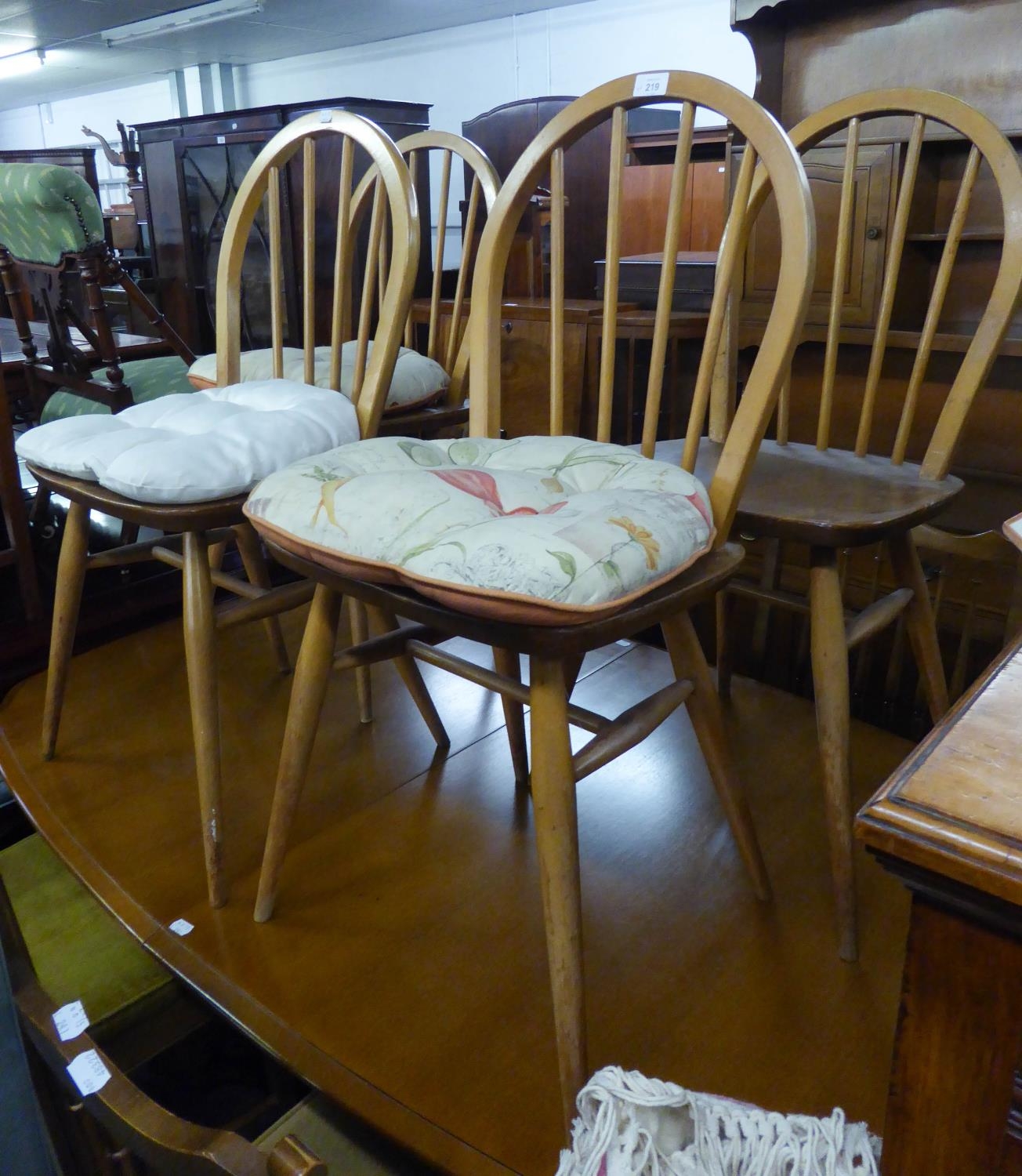 A SET OF FOUR ERCOL HARD WOOD HOOP BACK KITCHEN CHAIRS
