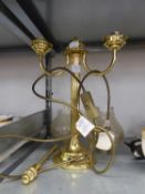 A GILT BRASS TABLE LAMP WITH TWO ?C? SCROLL BRANCHES AND AN OVAL PARCHMENT SHADE