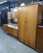 A G-PLAN TEAK BEDROOM SUITE OF THREE PIECES, TO INCLUDE; A TRIPLE WARDROBE (SPLIT), A DOUBLE