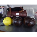 A PAIR OF LIGNUM VITAE LAWN BOWLS, IN CASE