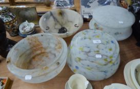 THREE 1930?s MOTTLED GLASS CEILING LIGHT SHADES, one with floral printed designs, together with