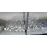 A SELECTION OF STEM CHAMPAGNE GLASSES AND BOWLS, ALSO A LARGE COLLECTION OF PLAIN STEM WINE GLASSES