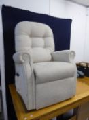 AN ELECTRICALLY ADJUSTABLE LOUNGE ARMCHAIR, COVERED IN BEIGE WOVEN FABRIC