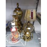 A BRASS OIL LAMP PATTERN ELECTRIC TABLE LAMP WITH GLASS SHADE; A POTTERY VASE TABLE LAMP AND