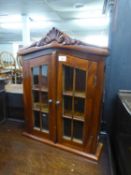 AN OAK TWO DOOR SMALL TABLE TOP DISPLAY CABINET