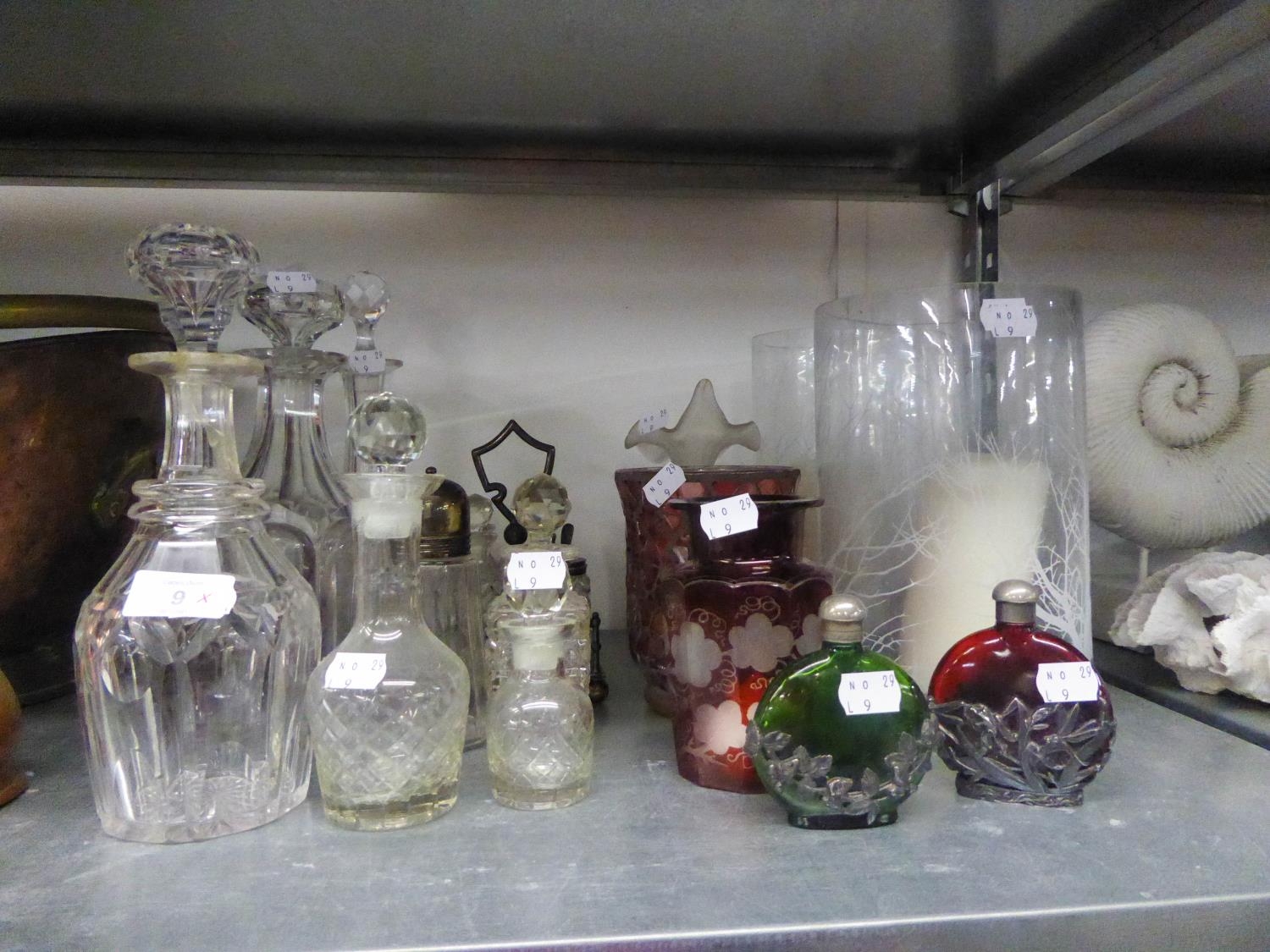 THREE VARIOUS ANTIQUE GLASS DECANTERS AND  A FOUR PIECE CONDIMENT SET ON PLATED STAND ETC...