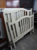 A PAINTED POSSIBLY EDWARDIAN CARVED BEDSTEAD