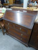 A DARK WOOD BUREAU, HAVING FALL-FRONT WITH SEMI-FITTED INTERIOR, OVER TWO SHORT AND TWO LONG DRAWERS