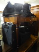 A SET OF THREE ANTLER GRADUATED BLACK CANVAS MODERN SUITCASES AND A HOLDALL (4)