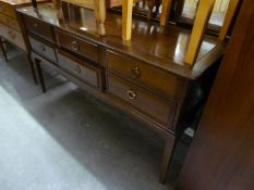 A STAG MAHOGANY SIX DRAWER DRESSING TABLE, HAVING TRIPLE MIRRORS, WITH STOOL (2)