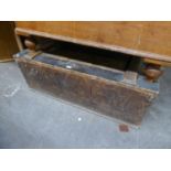 A LARGE WOODEN STORAGE BOX with hinged lid, possibly for storing costume
