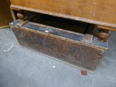 A LARGE WOODEN STORAGE BOX with hinged lid, possibly for storing costume