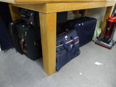 A LARGE BLUE CANVAS SUITCASE AND VARIOUS HOLDALLS
