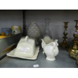 A CUT GLASS WINE DECANTER AND THREE PIECES OF WHITE GLAZED POTTERY INCLUDING; A PINEAPPLE