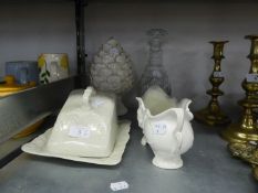 A CUT GLASS WINE DECANTER AND THREE PIECES OF WHITE GLAZED POTTERY INCLUDING; A PINEAPPLE