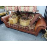 A LARGE THREE SEATER SETTEE, COVERED IN LIGHT BROWN LEATHER AND DIAMOND PATTERN FABRIC, WITH LOOSE