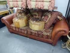 A LARGE THREE SEATER SETTEE, COVERED IN LIGHT BROWN LEATHER AND DIAMOND PATTERN FABRIC, WITH LOOSE