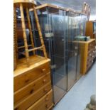 A SET OF THREE PLATE GLASS DISPLAY CABINETS, TALL AND NARROW (3)