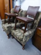 A PAIR OF PRE-WAR WINGED FIRESIDE ARMCHAIRS, COVERED IN FLORAL TAPESTRY, ON CABRIOLE FRONT SUPPORTS