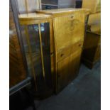 A WALNUTWOOD SIDE BY SIDE BUREAU DISPLAY CABINET, THE CENTRAL SECTION HAVING DROP-FRONT OVER A