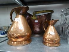 A COPPER AND BRAS COAL BUCKET, A 1/2 GALLON COPPER JUG AND A MATCHING PINT JUG (3)