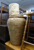 A LARGE WICKER ALI BABA LINEN BASKET AND COVER AND A WASTE PAPER BASKET (2)