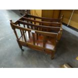 A MAHOGANY VICTORIAN STYLE MAGAZINE RACK WITH DRAWER BELOW