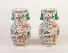 PAIR OF TWENTIETH CENTURY CHINESE PORCELAIN VASES, each of squat ovoid form with dog of fo pattern