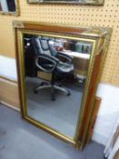 A RECTANGULAR BEVELLED EDGE WALL MIRROR, IN GILT FRAME, APPROXIMATELY 3?6? HIGH, 2?7? WIDE OVERALL