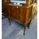 QUEEN ANNE STYLE LOW COCKTAIL CABINET WITH SEMI-FITTED INTERIOR, RAISED ON CABRIOLE LEGS (lacks