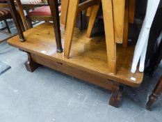 A RUSTIC STYLE ELM LARGE OBLONG COFFEE TABLE, WITH FOUR PLANK TOP, TRESTLE END SUPPORTS AND PLANK