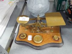 VINTAGE SET OF BRASS POSTAL BALANCE SCALES, on wooden base and six brass weights