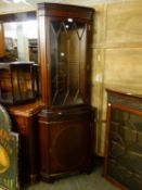 A MAHOGANY BOW FRONTED DOUBLE CORNER CUPBOARD