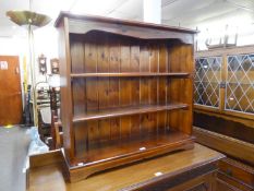 A STAINED ELM DWARF THREE TIER OPEN BOOKCASE, WITH TWO FIXED SHELVES, PLANKED BACK, PLINTH BASE,