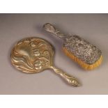 EMBOSSED SILVER BACKED DRESSING TABLE HAIR BRUSH, decorated with flower heads ad C scrolls,