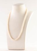 SINGLE STRAND NECKLACE OF UNIFORM CULTURED PEARLS with metal screw clasp, 17in (43.1cm) long, 89