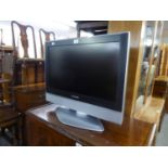 PANASONIC VIERA FLAT SCREEN TELEVISION, 25?, ON BLACK GLASS THREE-TIER STAND, WITH JVC VIDEO