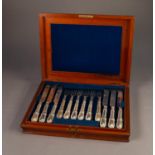 LATE VICTORIAN MAHOGANY CASED SET OF NINE WHITE METAL HANDLED KNIVES AND TEN FORKS, filled,