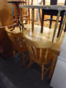 LIGHT WOOD DINING TABLE ON TURNED LEGS WITH  MATCHING SET OF FOUR STICK BACK DINING CHAIRS