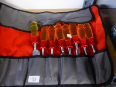 A SET OF EIGHT MAGMA CHISELS, WITH YELLOW PLASTIC HANDLES, IN ROLL