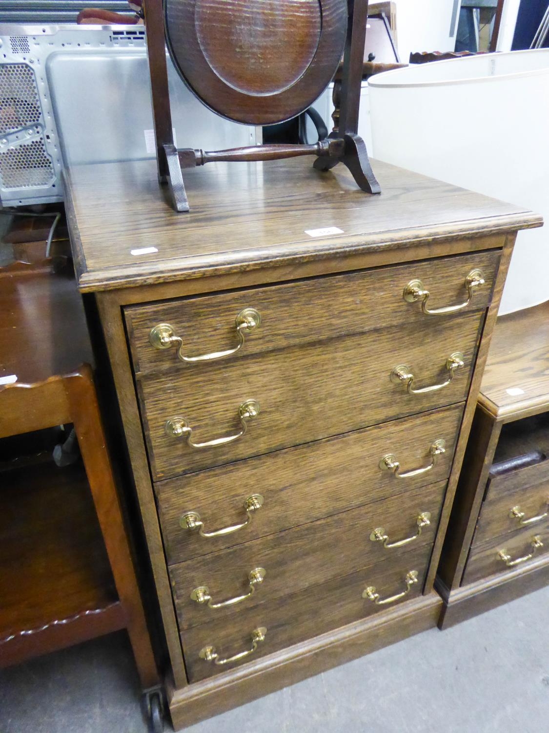 AN ELM CHEST OF FIVE LONG DRAWERS, THE FIVE DIAPER DRAWERS FITTED FOR CD STORAGE, BRASS DROP